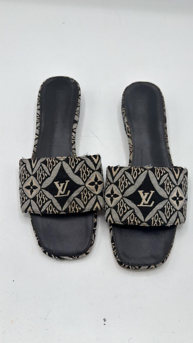 Louis Vuitton "Since 1854" Lock It Flat Mules