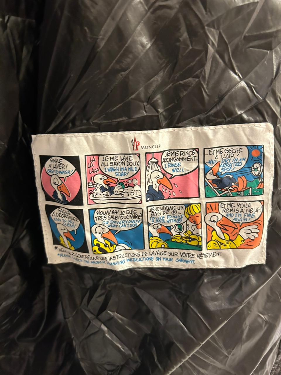 Moncler Women's down puffer jacket with a fur-trimmed hood.