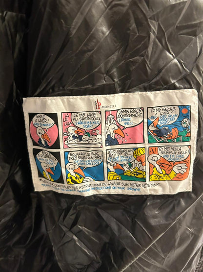 Moncler Women's down puffer jacket with a fur-trimmed hood.