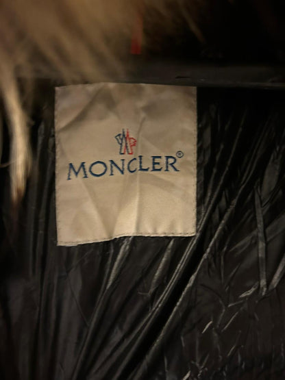 Moncler Women's down puffer jacket with a fur-trimmed hood.