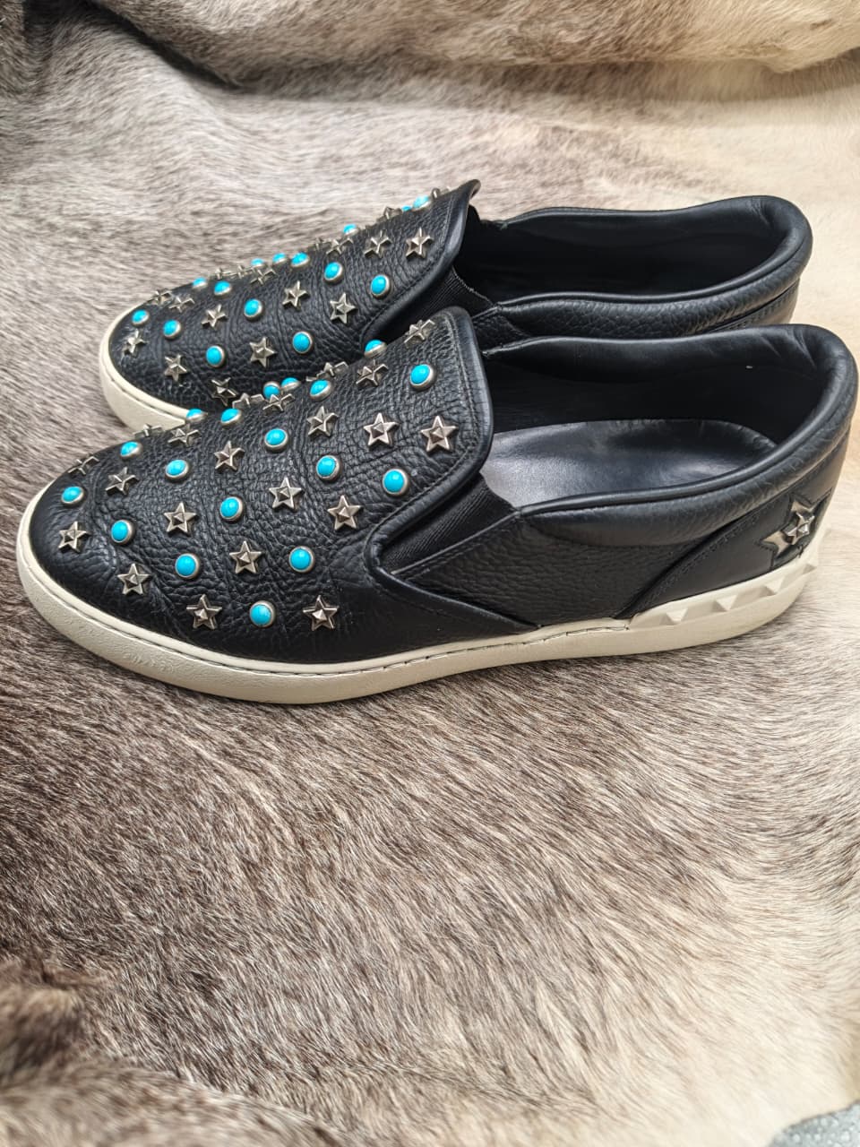 Star-and-turquoise studded slip-on sneakers