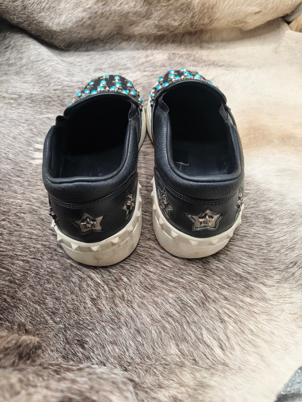 Star-and-turquoise studded slip-on sneakers