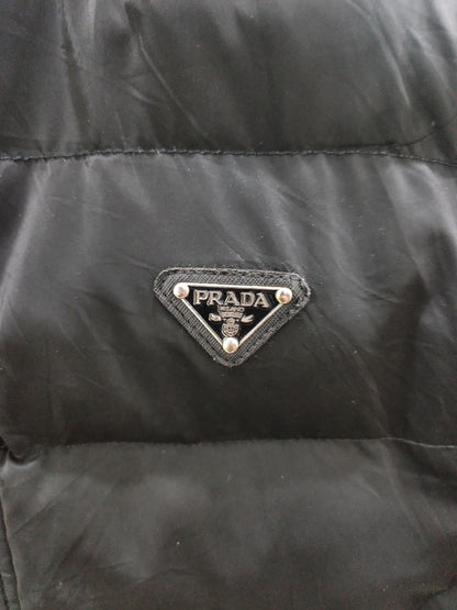 Prada-style black puffer jacket (triangle logo)