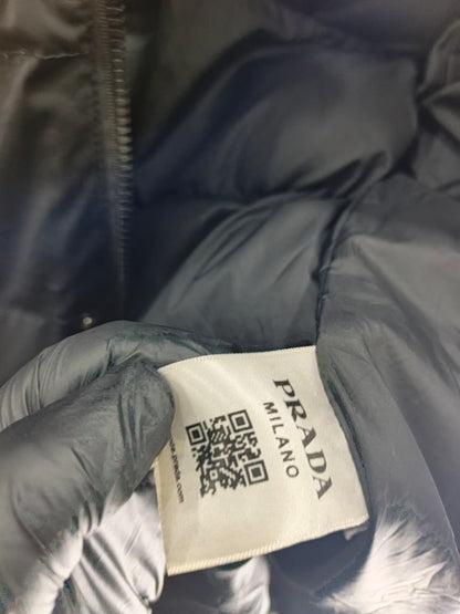 Prada-style black puffer jacket (triangle logo)
